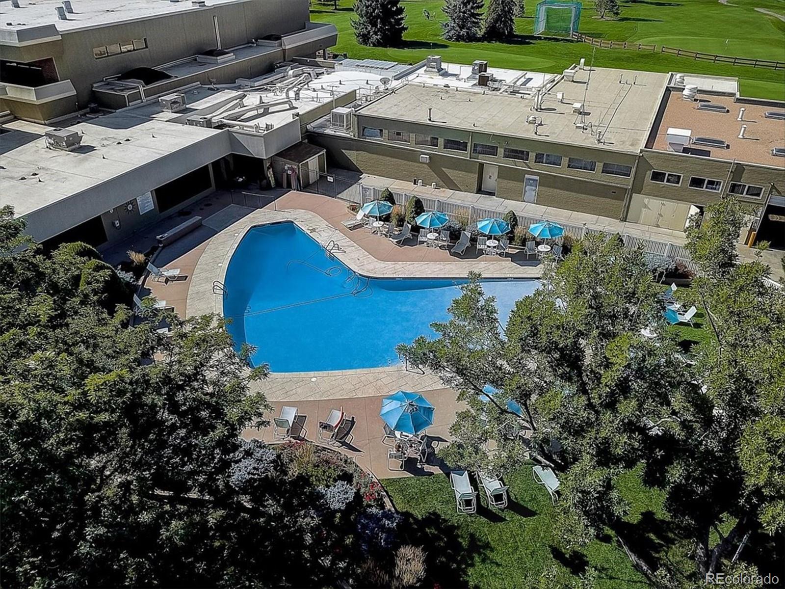 9155 Center Avenue, Unit 3B Denver, CO 80247 - Photo 30 of 50 a view of a house with pool and chairs
