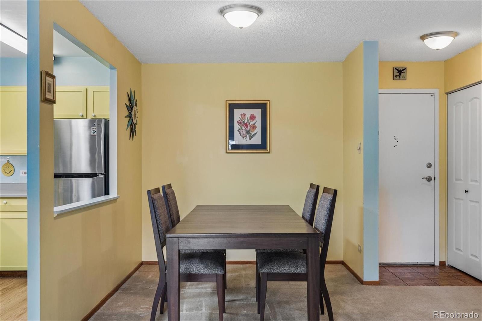 9155 Center Avenue, Unit 3B Denver, CO 80247 - Photo 4 of 50 a view of a dining room with furniture