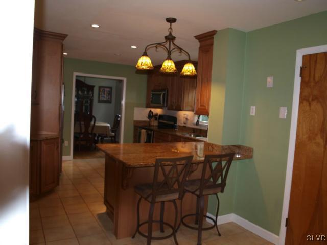 1909 Dartford Road Bethlehem, PA 18015 - Photo 12 of 21 a dining room with furniture a chandelier and wooden floor