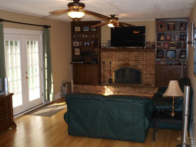 1909 Dartford Road Bethlehem, PA 18015 - Photo 14 of 21 a living room with furniture a flat screen tv and a fireplace