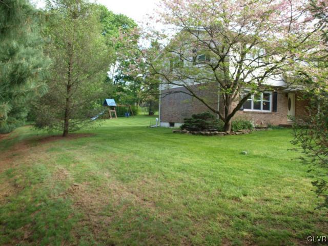 1909 Dartford Road Bethlehem, PA 18015 - Photo 3 of 21 a view of a tree in front of a house