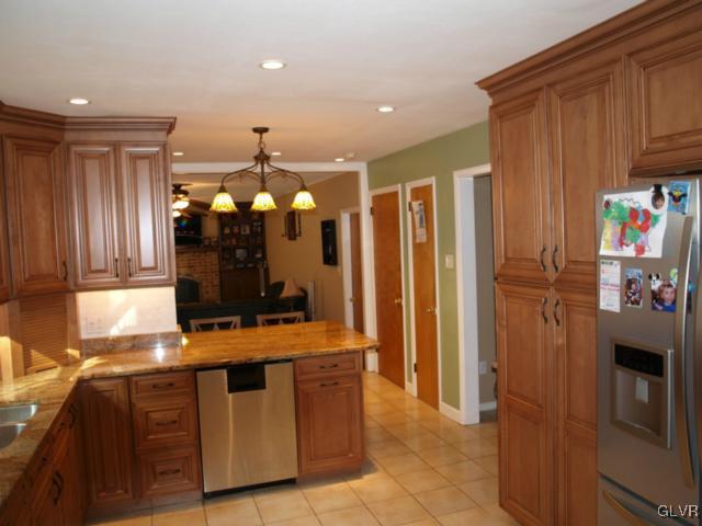 1909 Dartford Road Bethlehem, PA 18015 - Photo 10 of 21 a kitchen with stainless steel appliances granite countertop a refrigerator and a stove
