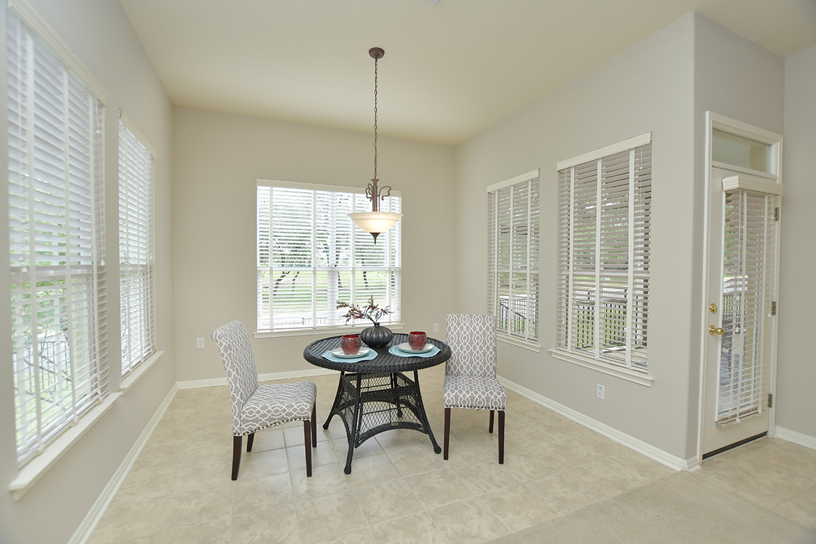 120 Golf View Drive Georgetown, TX 78633 - Photo 16 of 32 At the back of the family room, light floods the breakfast area with windows on all sides.