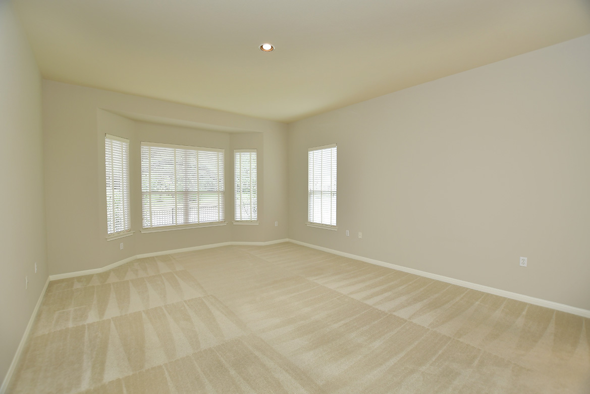 120 Golf View Drive Georgetown, TX 78633 - Photo 19 of 32 A bay windows in the primary bedroom is the perfect spot for a reading nook or a writing desk.