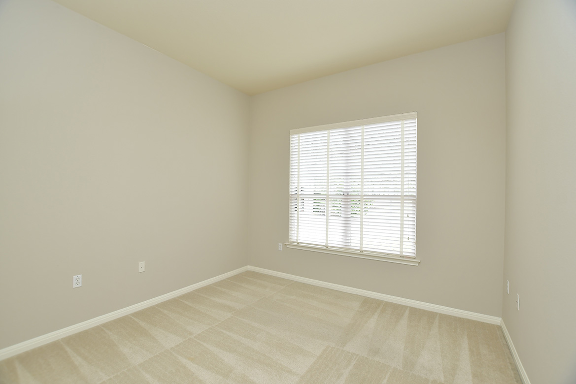 120 Golf View Drive Georgetown, TX 78633 - Photo 24 of 32 The guest bedroom with double window looks to the front of the home.