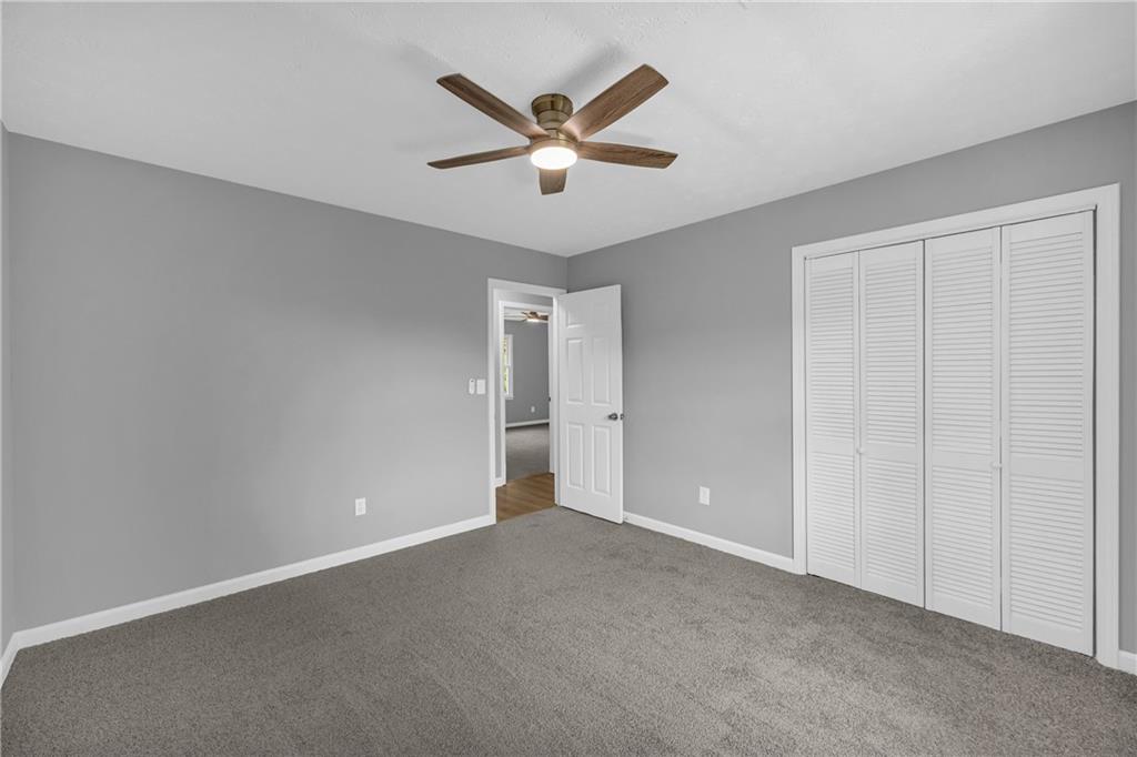 4872 Arrowhead Trail W Southwest Lilburn, GA 30047 - Photo 23 of 44 a view of an empty room