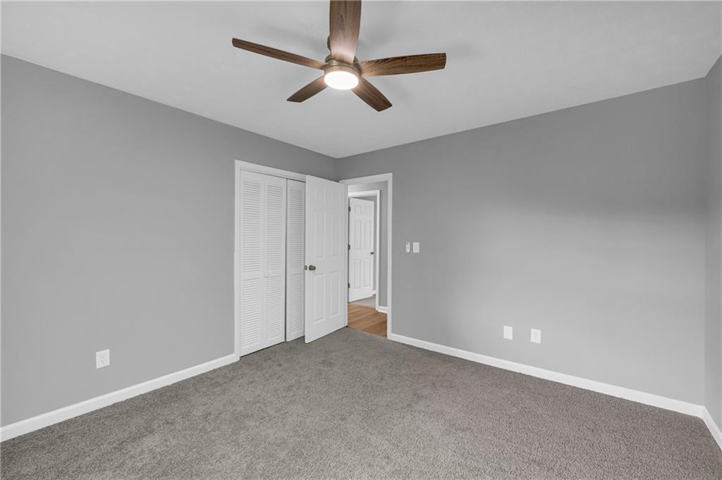 4872 Arrowhead Trail W Southwest Lilburn, GA 30047 - Photo 25 of 44 a view of an empty room
