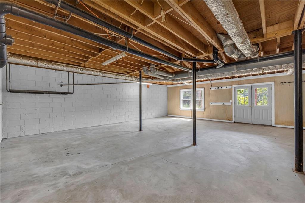 4872 Arrowhead Trail W Southwest Lilburn, GA 30047 - Photo 32 of 44 a view of an empty room