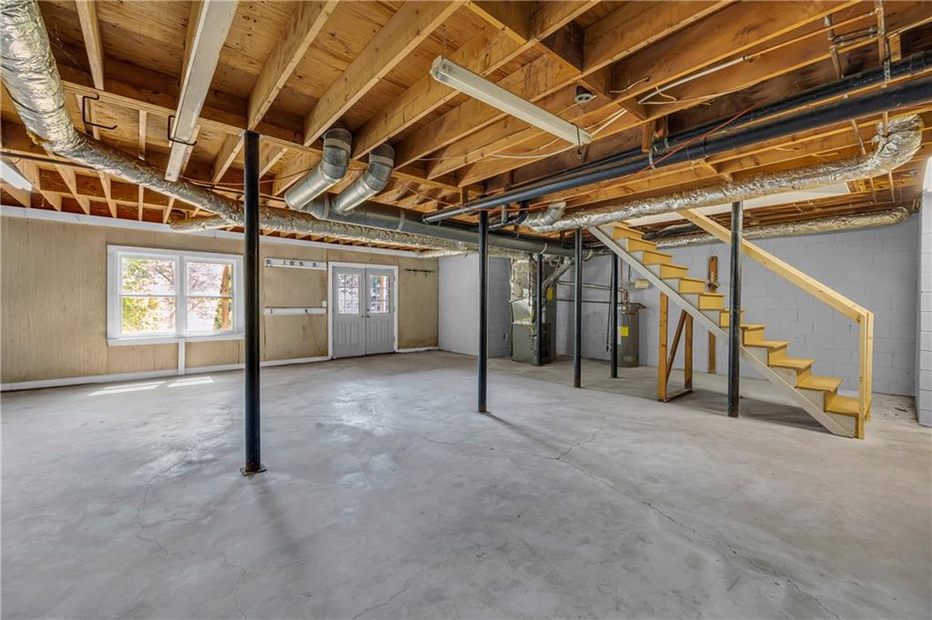 4872 Arrowhead Trail W Southwest Lilburn, GA 30047 - Photo 33 of 44 a view of an empty room with windows