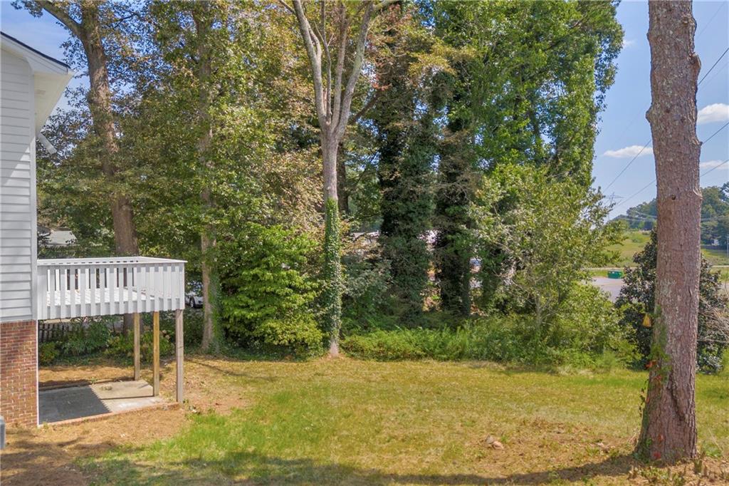 4872 Arrowhead Trail W Southwest Lilburn, GA 30047 - Photo 38 of 44 a view of backyard with green space