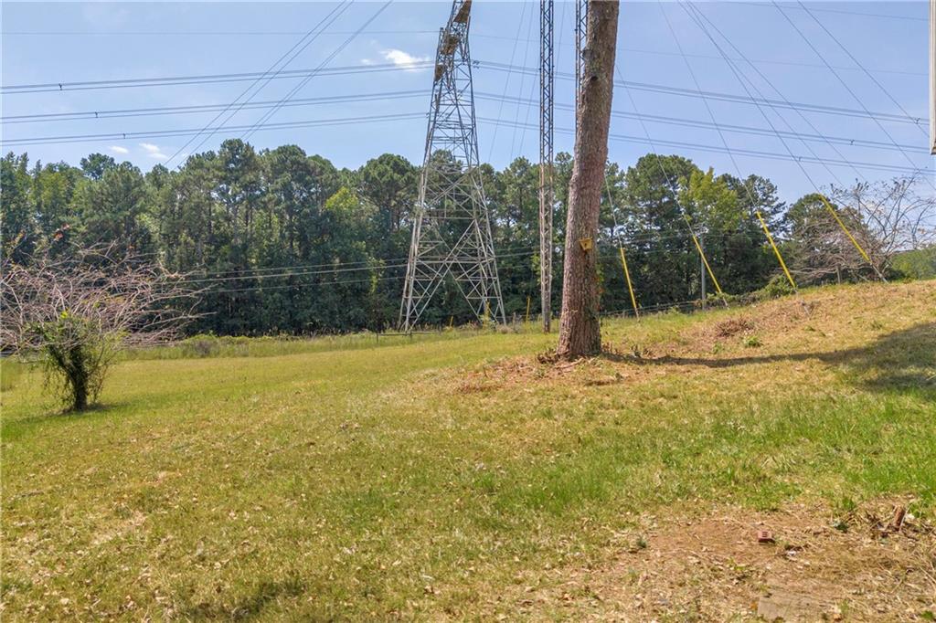 4872 Arrowhead Trail W Southwest Lilburn, GA 30047 - Photo 39 of 44 a view of a yard with palm trees