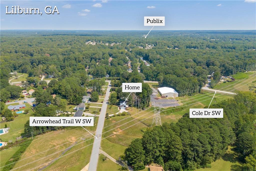 4872 Arrowhead Trail W Southwest Lilburn, GA 30047 - Photo 41 of 44 a view of a wall with a street sign