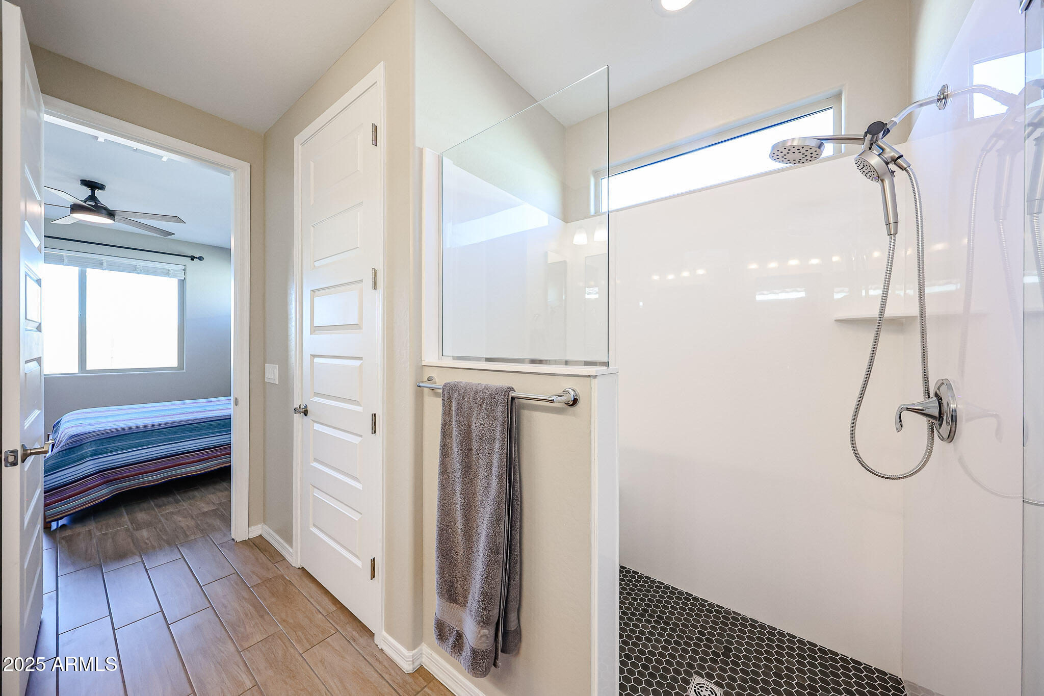 18062 West Amber Ridge Way Goodyear, AZ 85338 - Photo 24 of 67 a bathroom with a shower and a sink