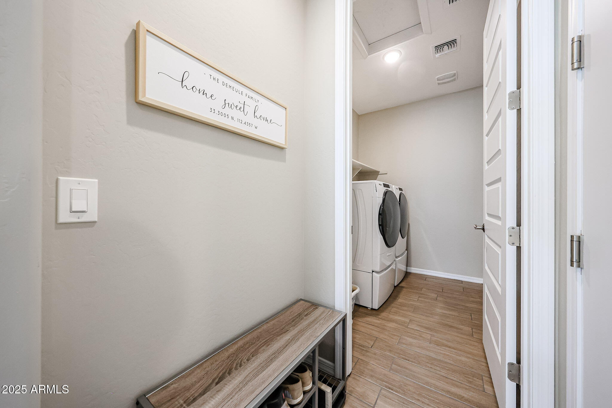 18062 West Amber Ridge Way Goodyear, AZ 85338 - Photo 32 of 67 a view of a hallway with wooden floor and washer
