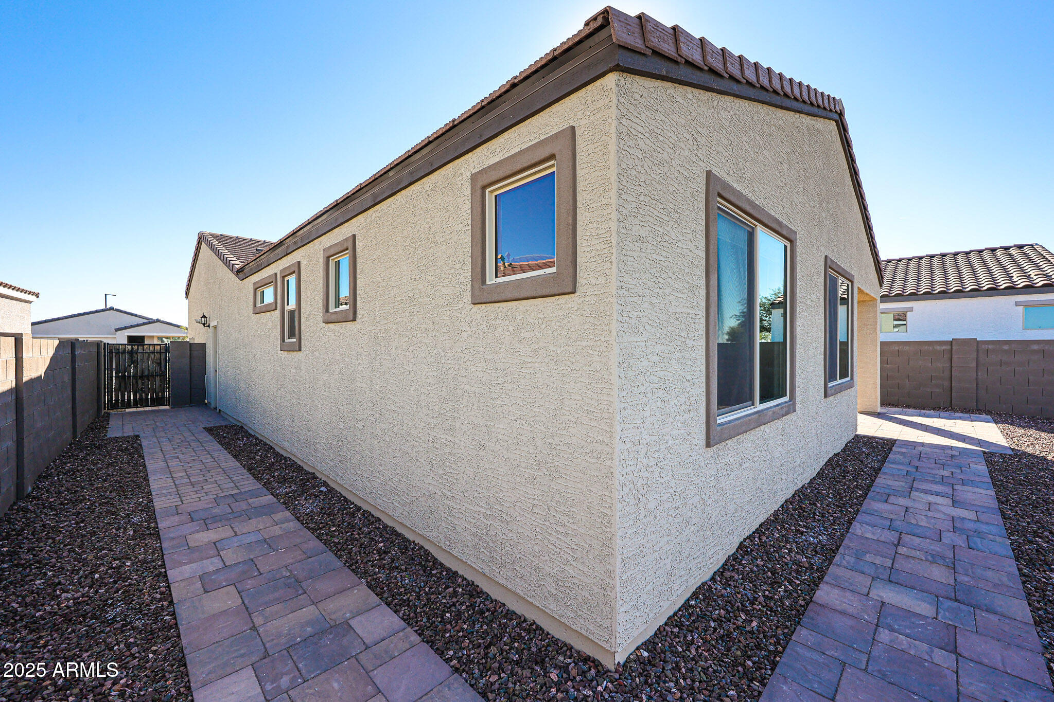 18062 West Amber Ridge Way Goodyear, AZ 85338 - Photo 36 of 67 a view of a house with a yard
