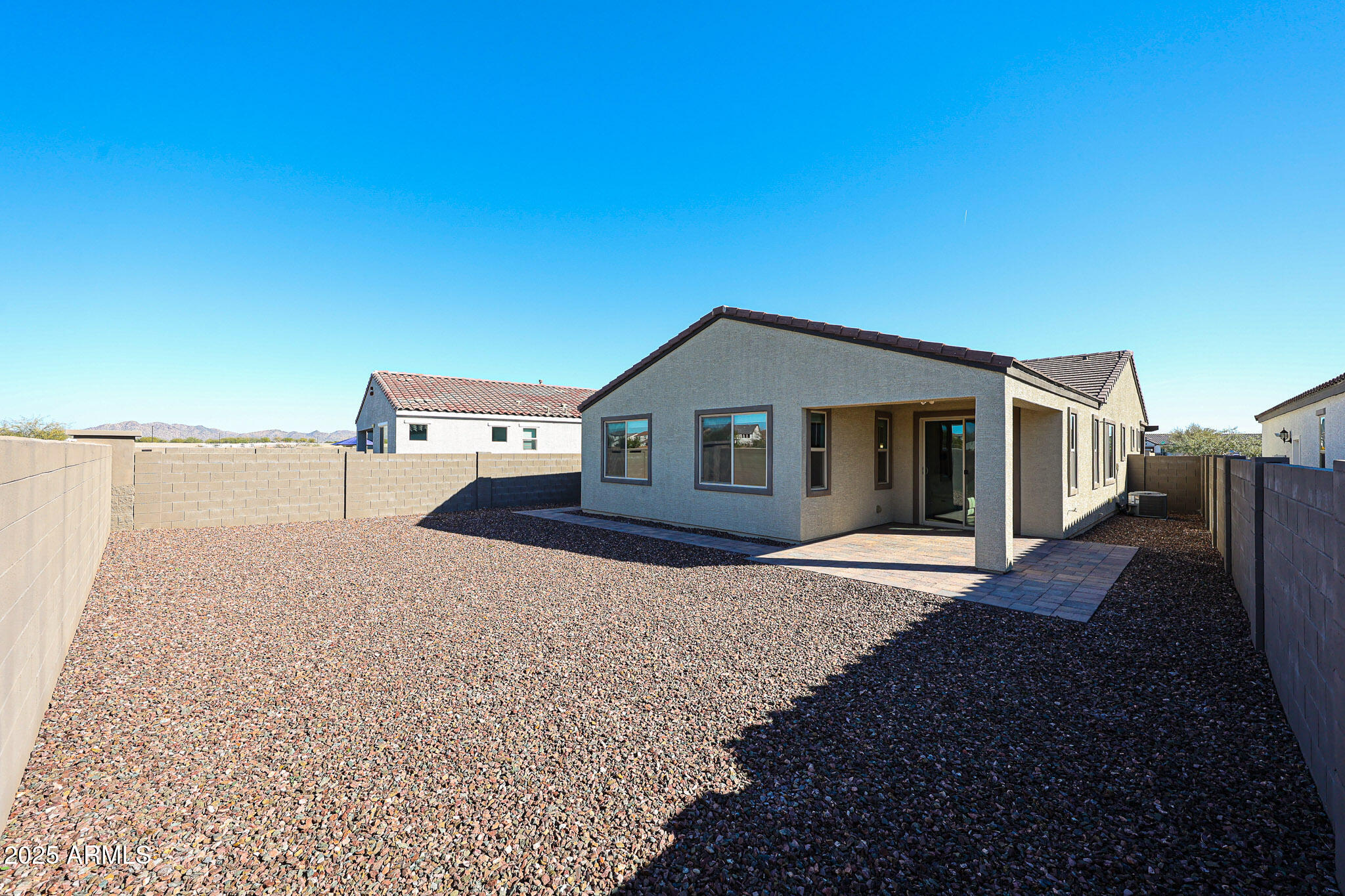 18062 West Amber Ridge Way Goodyear, AZ 85338 - Photo 40 of 67 a house view with a backyard space