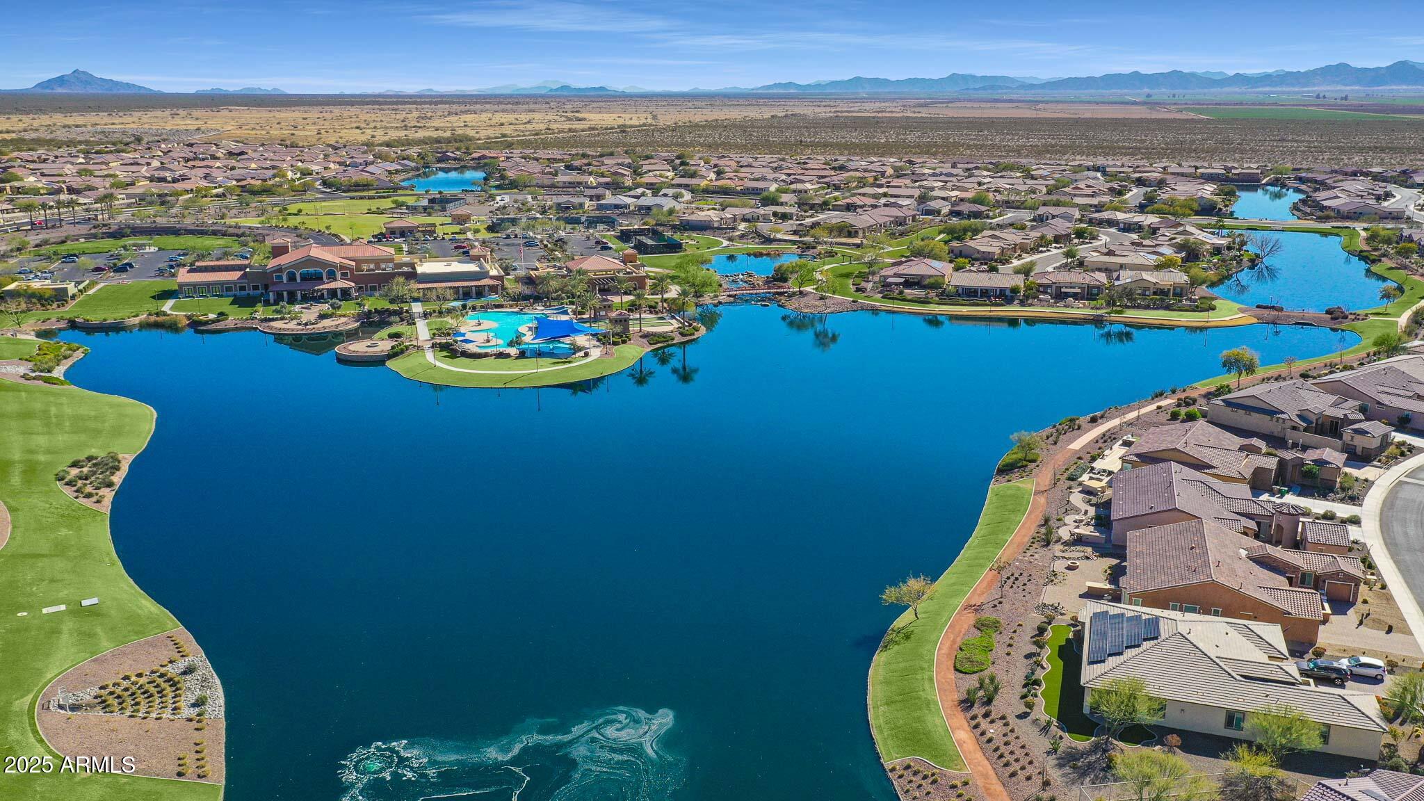 18062 West Amber Ridge Way Goodyear, AZ 85338 - Photo 64 of 67 an aerial view of a house with a lake view