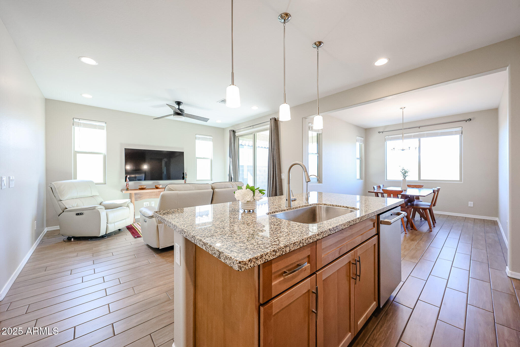 18062 West Amber Ridge Way Goodyear, AZ 85338 - Photo 8 of 67 a view of living room with granite countertop furniture and fireplace