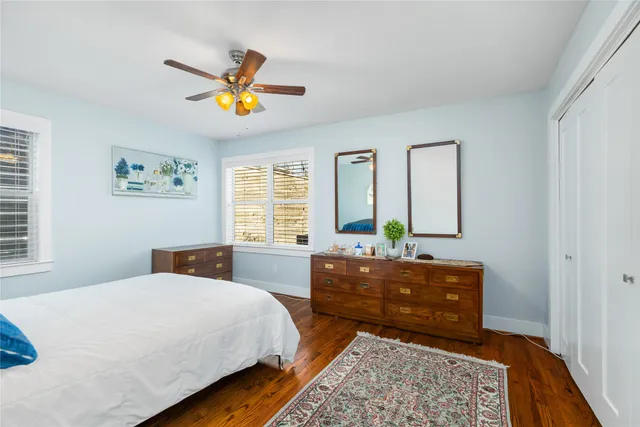 a bedroom with a bed and a dresser