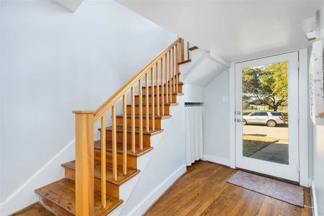 a view of entryway with wooden floor