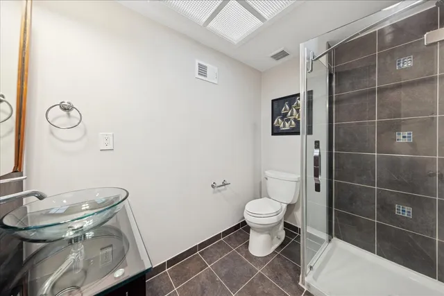 a kitchen with a sink window and stainless steel appliances