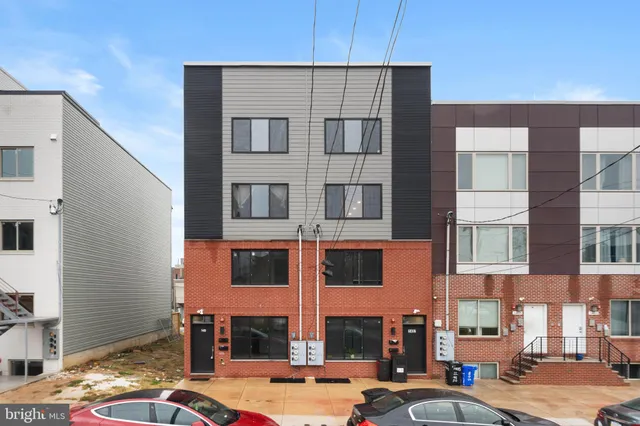 a city street lined with buildings and cars