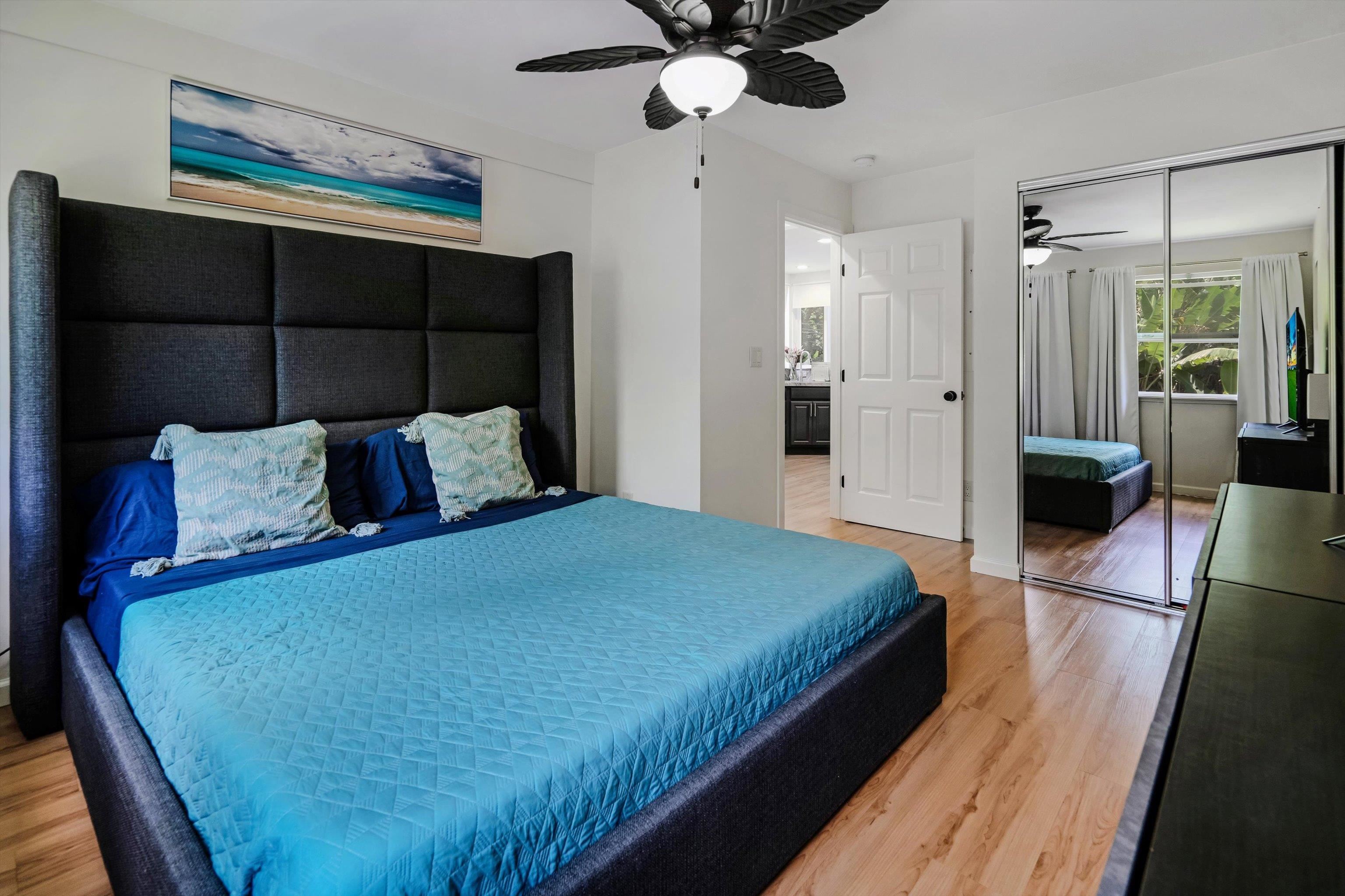 303 Waipalani Road Haiku, HI 96708 - Photo 15 of 46 a bedroom with a bed and a walk in closet