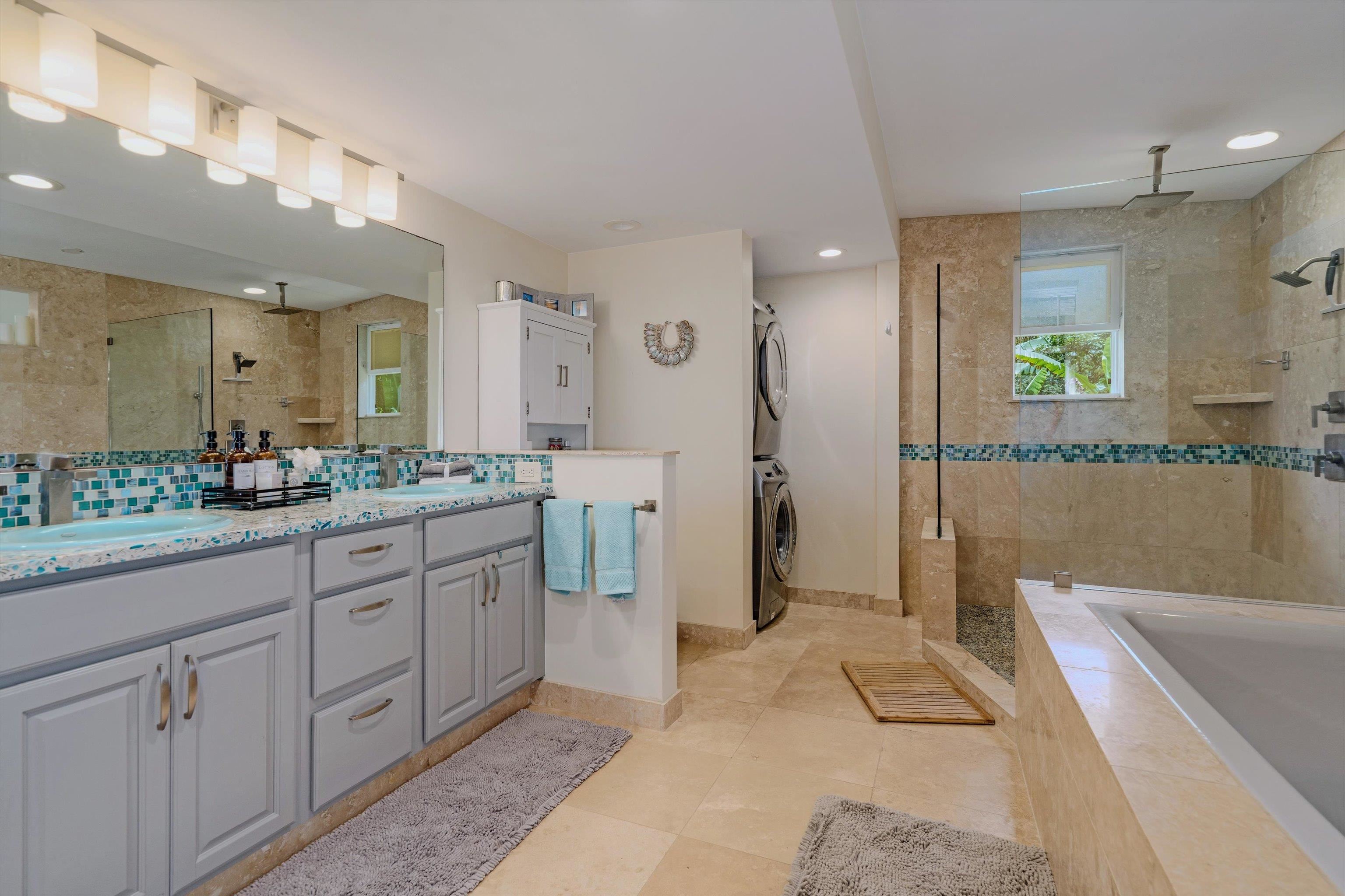 303 Waipalani Road Haiku, HI 96708 - Photo 21 of 46 a spacious bathroom with a double vanity sink and a mirror