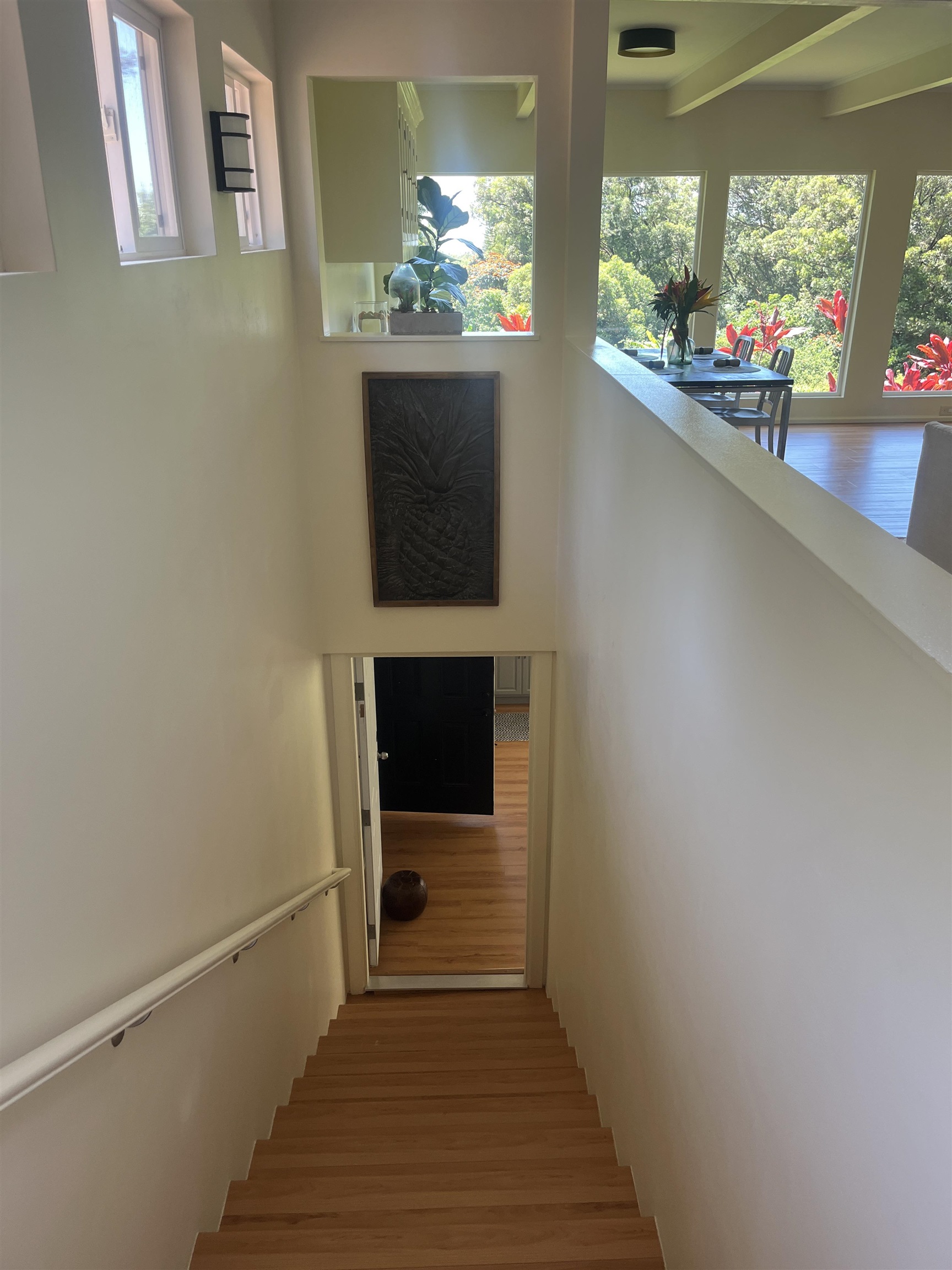 303 Waipalani Road Haiku, HI 96708 - Photo 26 of 46 a view of a hallway with wooden floor and staircase