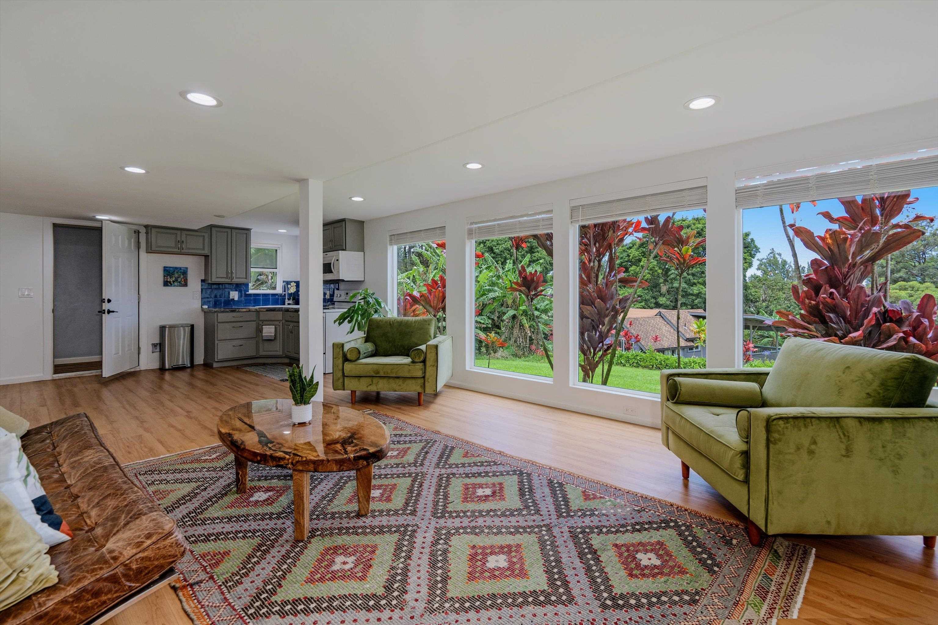 303 Waipalani Road Haiku, HI 96708 - Photo 28 of 46 a living room with furniture and a large window