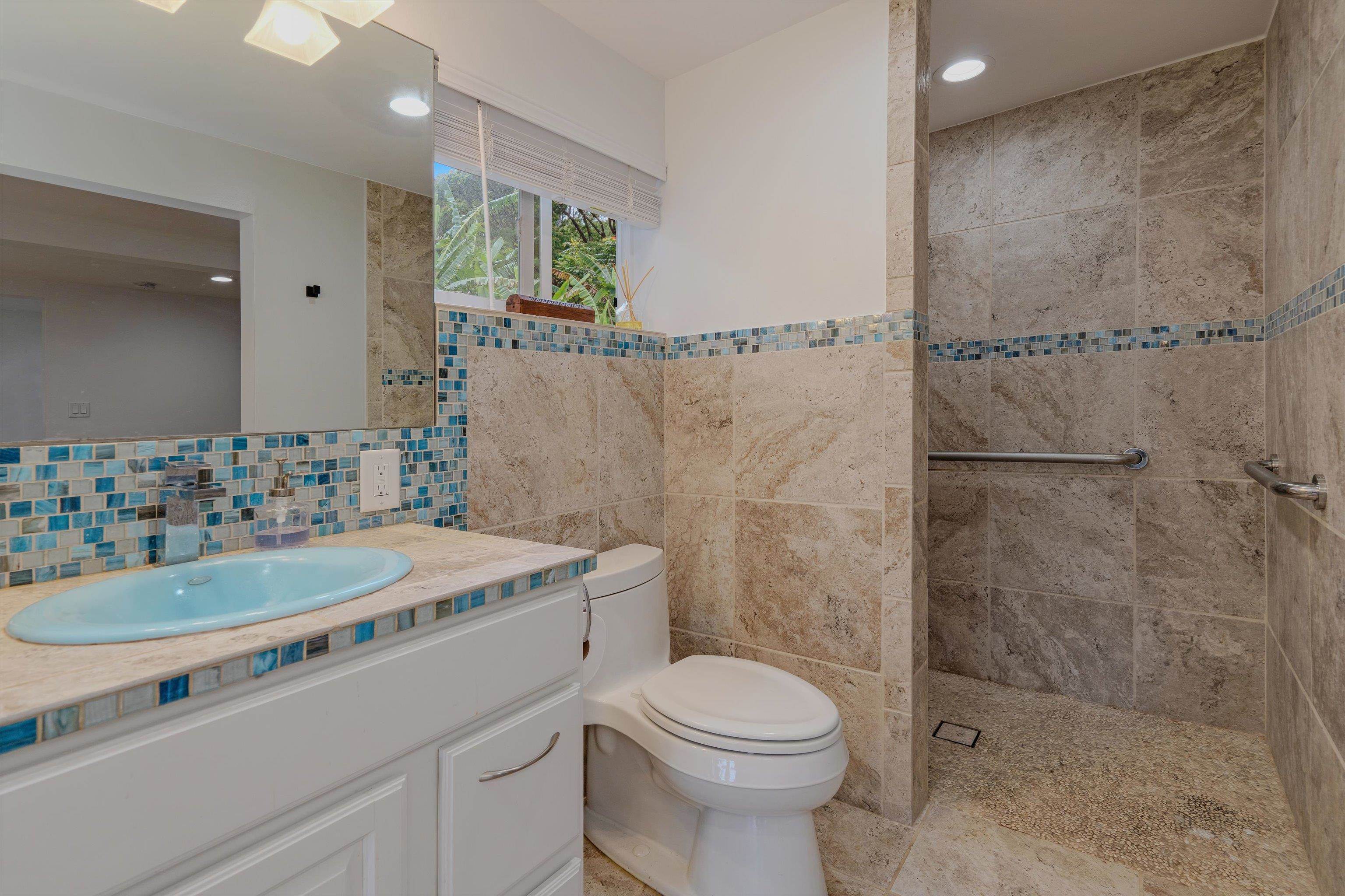 303 Waipalani Road Haiku, HI 96708 - Photo 30 of 46 a bathroom with a sink a toilet and shower