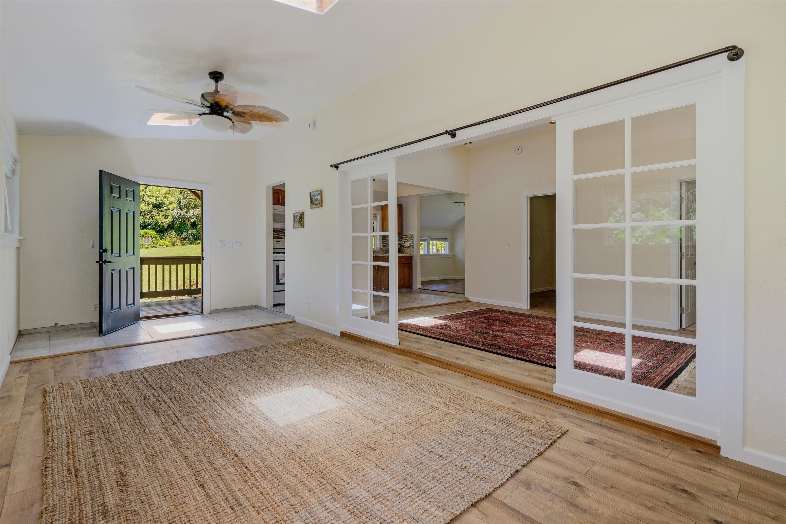 303 Waipalani Road Haiku, HI 96708 - Photo 36 of 46 a view of empty room with wooden floor and fan