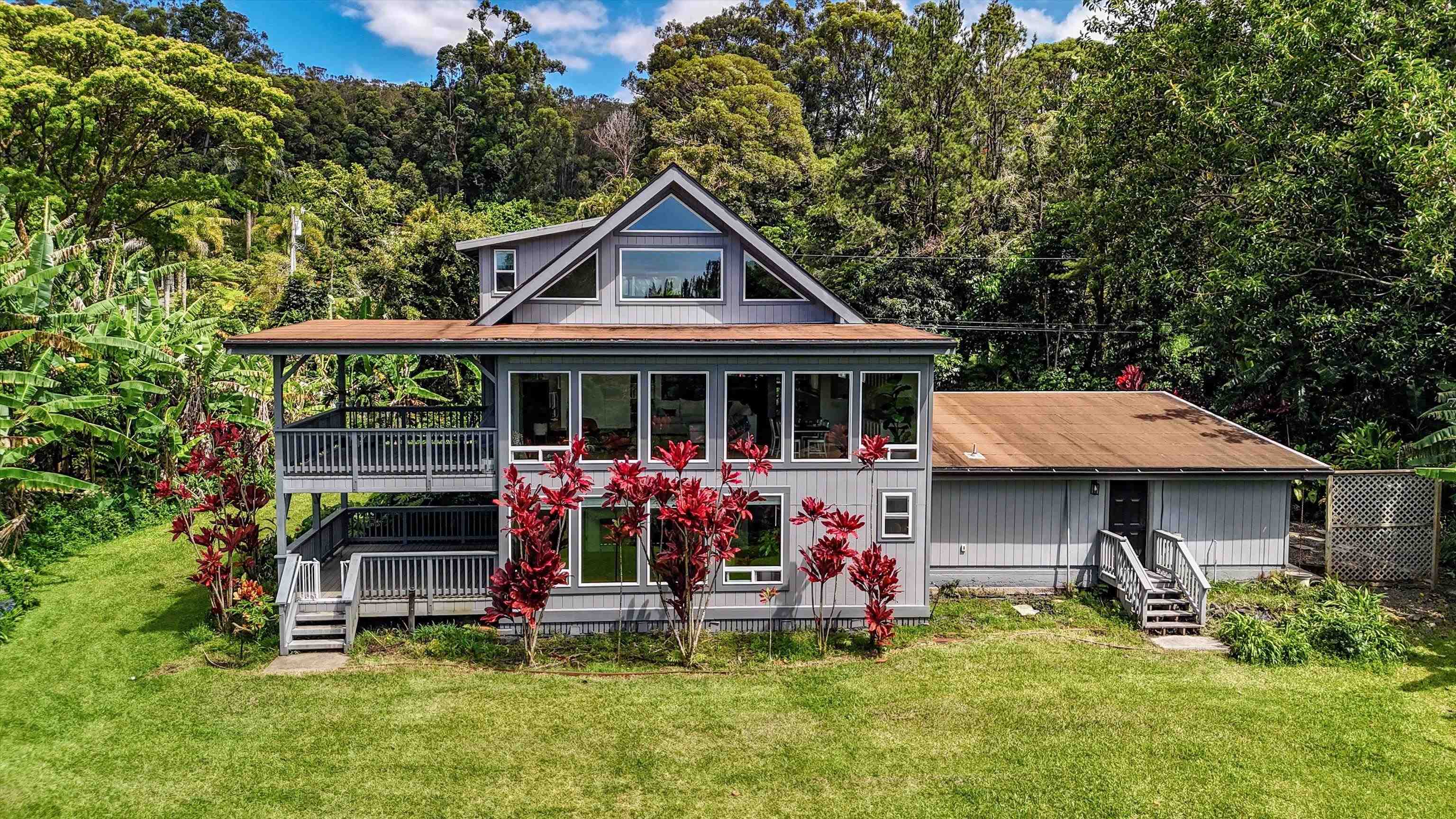 303 Waipalani Road Haiku, HI 96708 - Photo 43 of 46 a view of a house with a yard patio and a garden