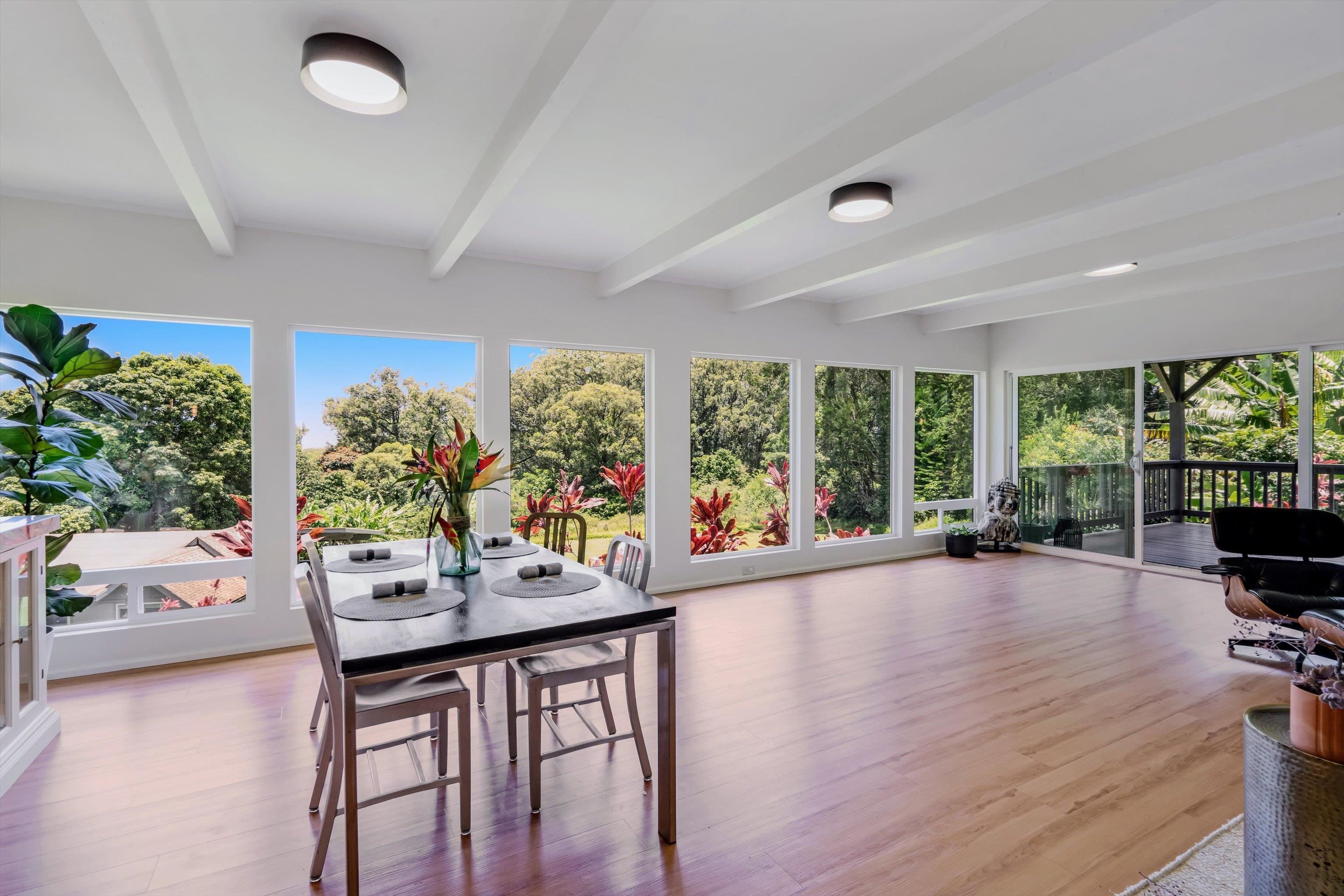 303 Waipalani Road Haiku, HI 96708 - Photo 8 of 46 a dining room with furniture and a floor to ceiling window