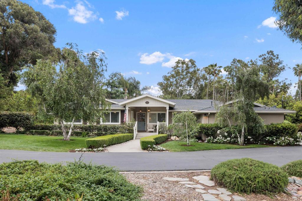 16623 Avenida Florencia Poway, CA 92064 - Photo 1 of 1 a front view of a house with a yard and potted plants