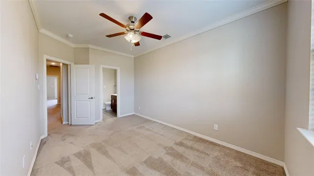 an empty room with a ceiling fan and a ceiling fan