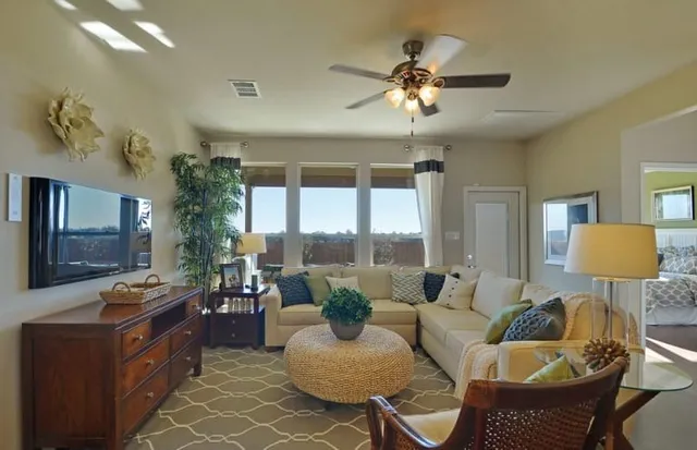 a living room with furniture and a large window