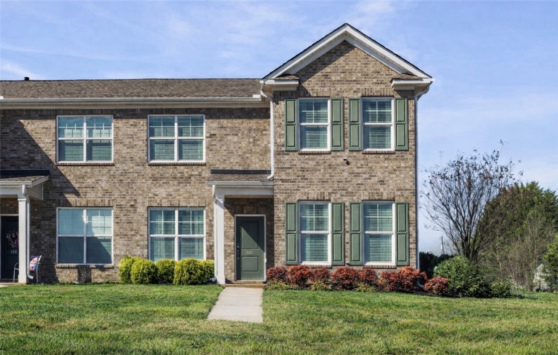 221 Scenic Drive Anderson, SC 29621 - Photo 1 of 27 This two-story brick home features a well-maintained lawn and classic shutters, offering charming curb appeal.