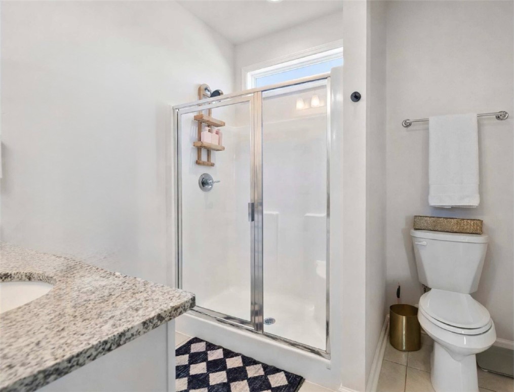 221 Scenic Drive Anderson, SC 29621 - Photo 13 of 27 This bathroom features a contemporary shower and a convenient vanity with ample counter space.