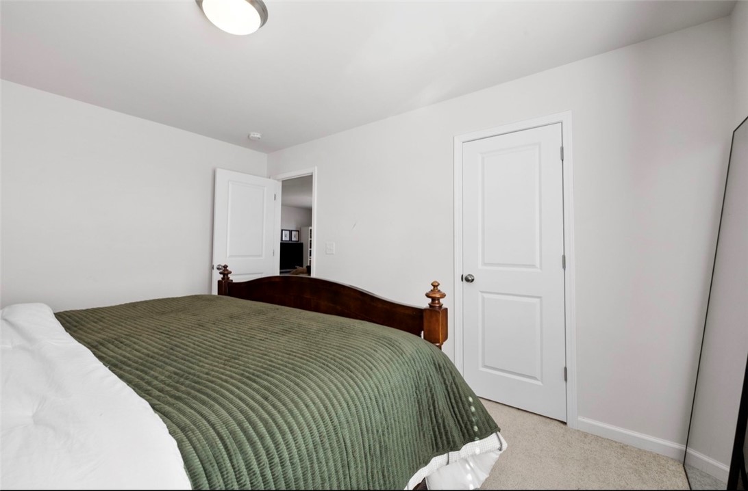 221 Scenic Drive Anderson, SC 29621 - Photo 19 of 27 This spacious bedroom offers comfortable living with soft carpet flooring and ample natural light.