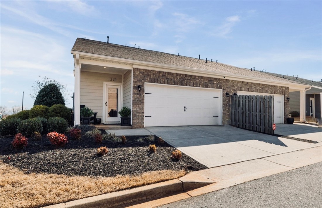 221 Scenic Drive Anderson, SC 29621 - Photo 24 of 27 This charming residence features an attached garage and a neatly landscaped front entrance.