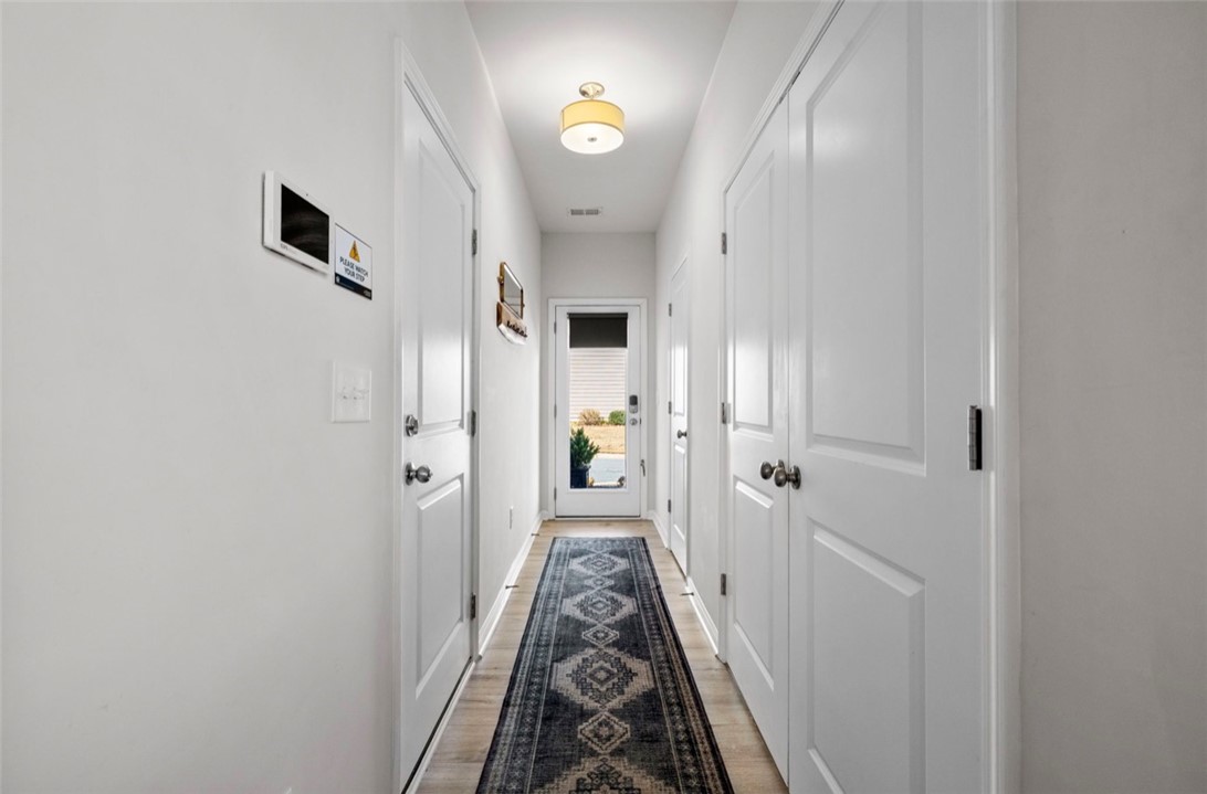 221 Scenic Drive Anderson, SC 29621 - Photo 9 of 27 This inviting hallway features durable flooring, leading to a bright exterior view.