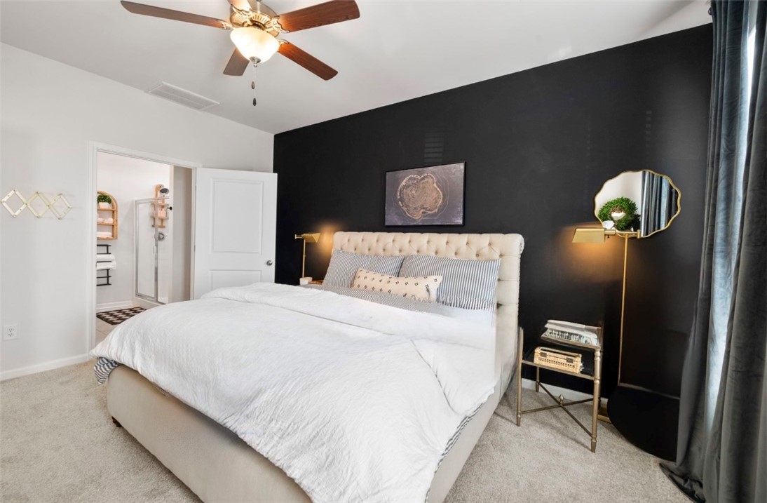 221 Scenic Drive Anderson, SC 29621 - Photo 10 of 27 This primary bedroom features a plush bed and access to a private bathroom.