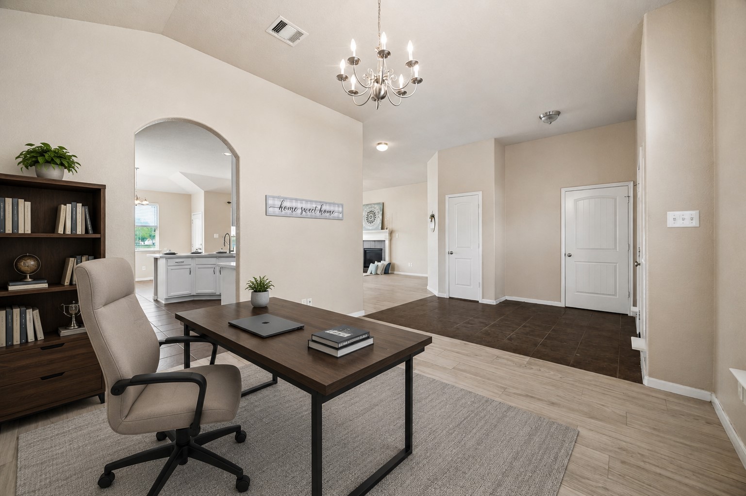 7806 Summer Night Lane Rosenberg, TX 77469 - Photo 6 of 23 An arched doorway provides a direct view from the front living area into the kitchen and breakfast nook. **This room has been virtually staged.