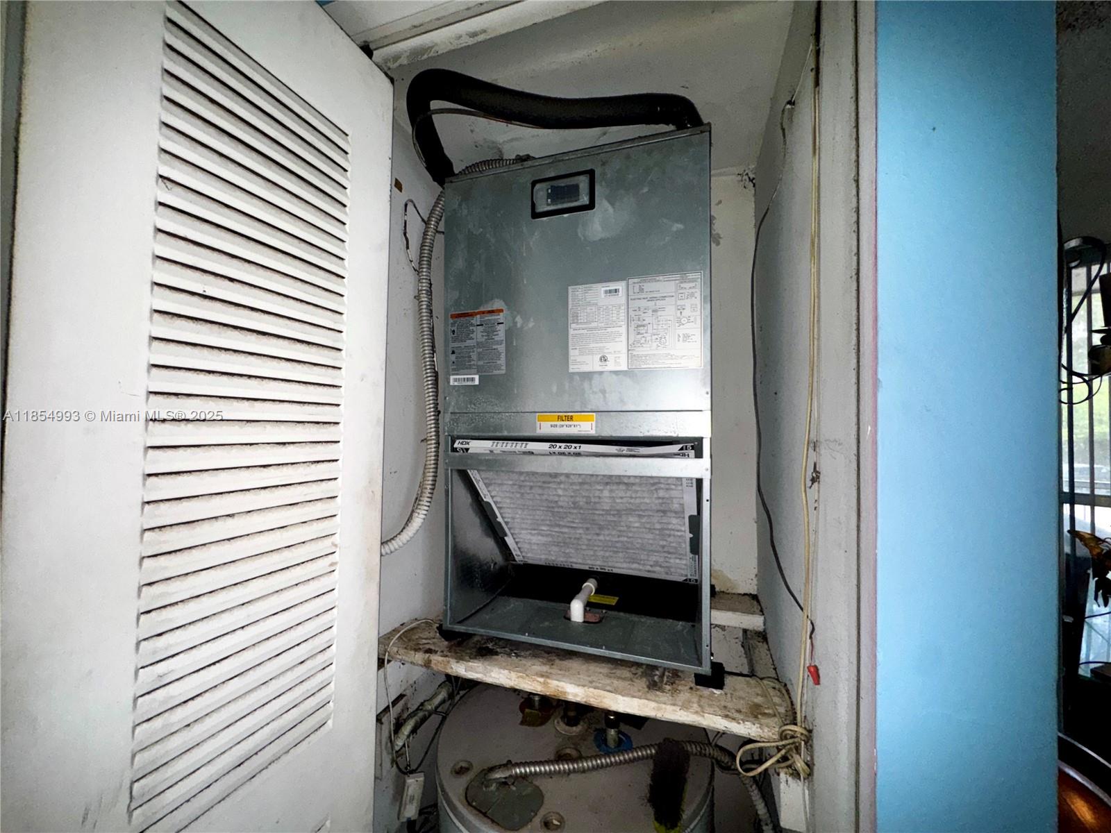 7165 Northwest 186th Street, Unit A211 Hialeah, FL 33015 - Photo 11 of 15 a room with storage and utility