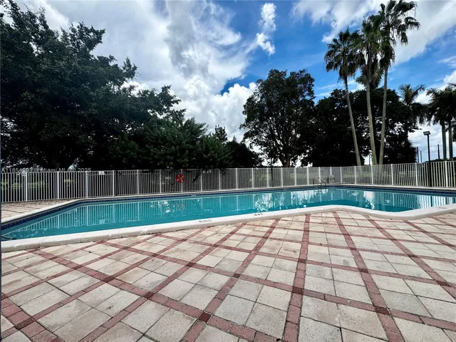 a view of backyard with trampoline