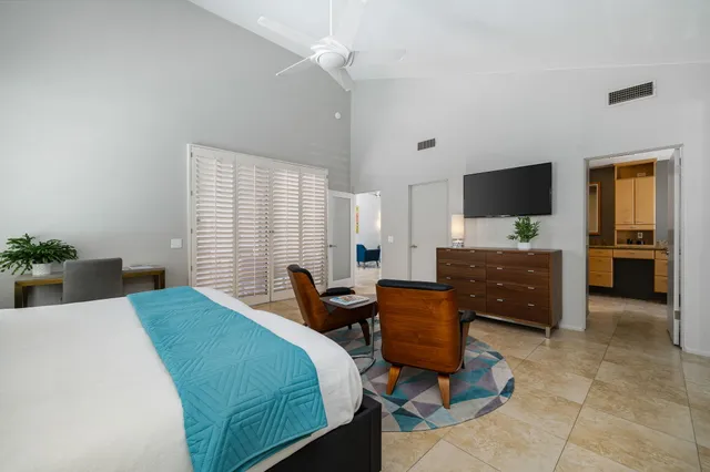 a bedroom with a bed and furniture