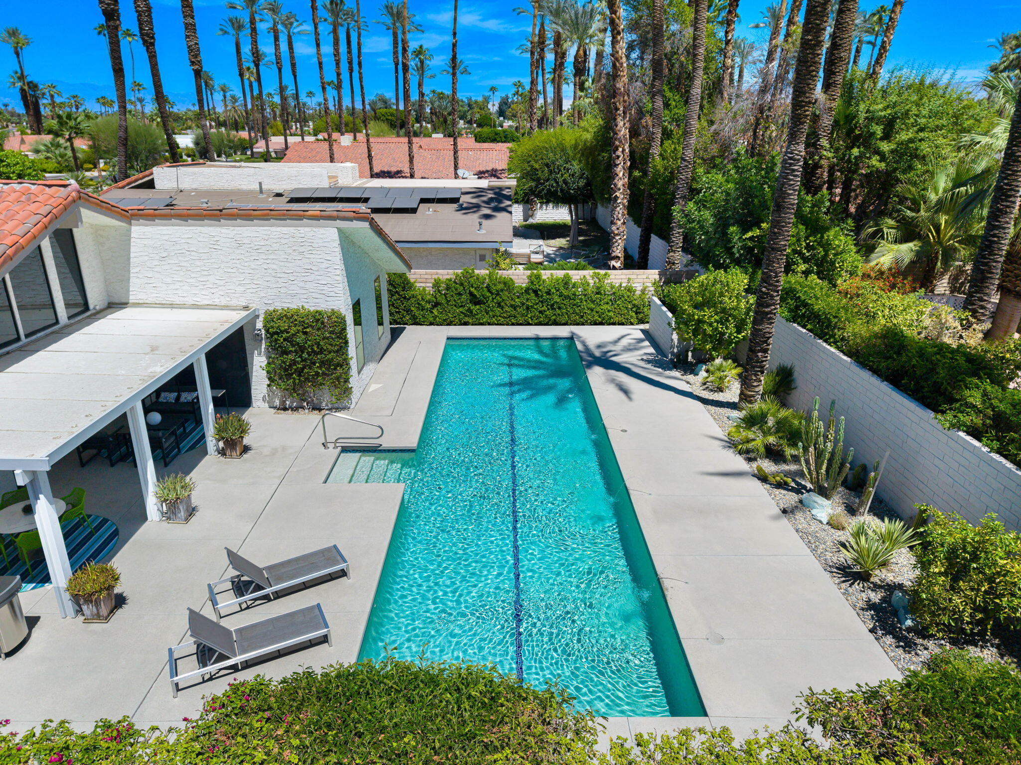 41 Lincoln Place Rancho Mirage, CA 92270 - Photo 2 of 37 a backyard of a house with a yard and outdoor seating