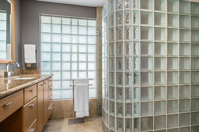 a view of a kitchen with a sink and a window