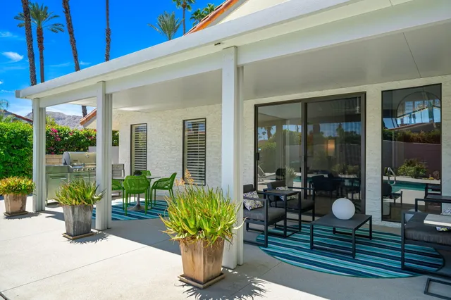 a lobby with furniture and potted plant